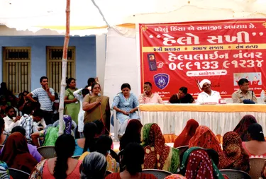 A group of panelists sitting in front of a crowd.